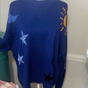 Rails Blue Sweater with Star and Sun Design which is also the back of sweater.
